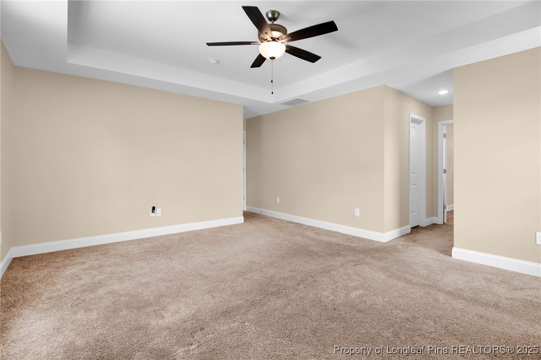 405 Shelton Beard Road Stedman, NC 28391 - Photo 21 of 36 an empty room with a ceiling fan and a ceiling fan