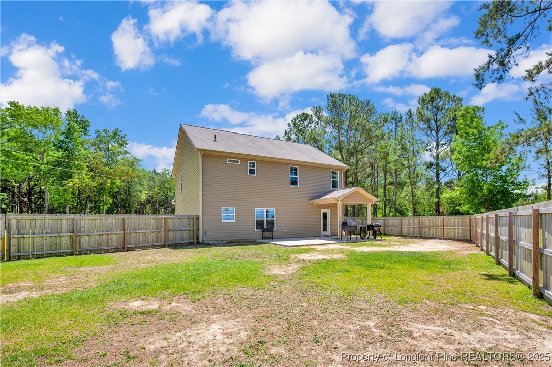 405 Shelton Beard Road Stedman, NC 28391 - Photo 35 of 36 a view of a house with backyard and sitting area