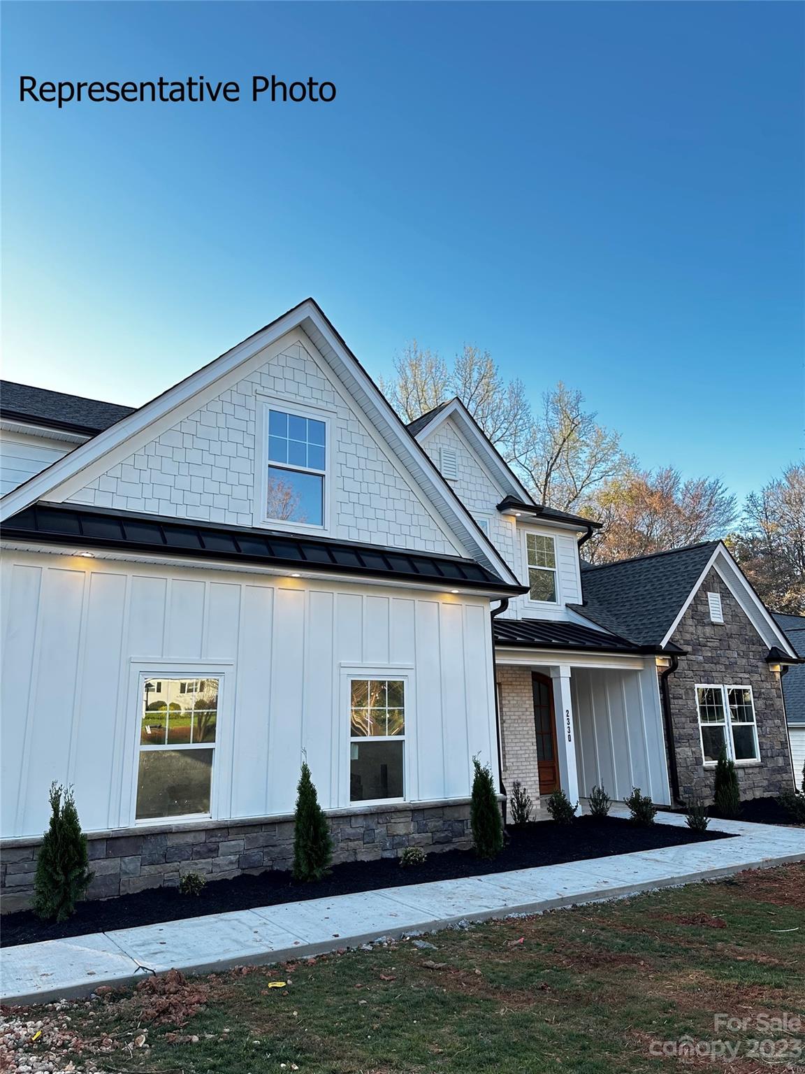 2432 Lakeview Circle Matthews, NC 28105 - Photo 1 of 20 a front view of a house with a yard