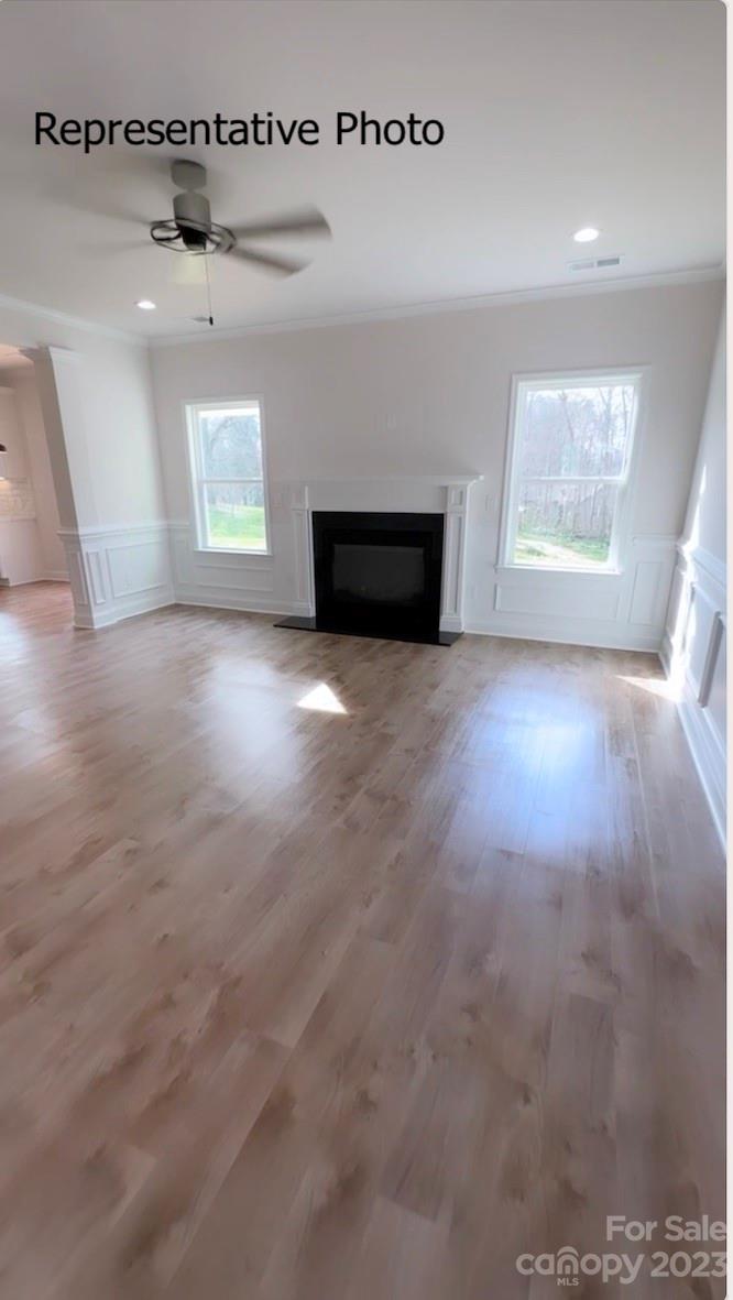 2432 Lakeview Circle Matthews, NC 28105 - Photo 16 of 20 an empty room with windows and fireplace