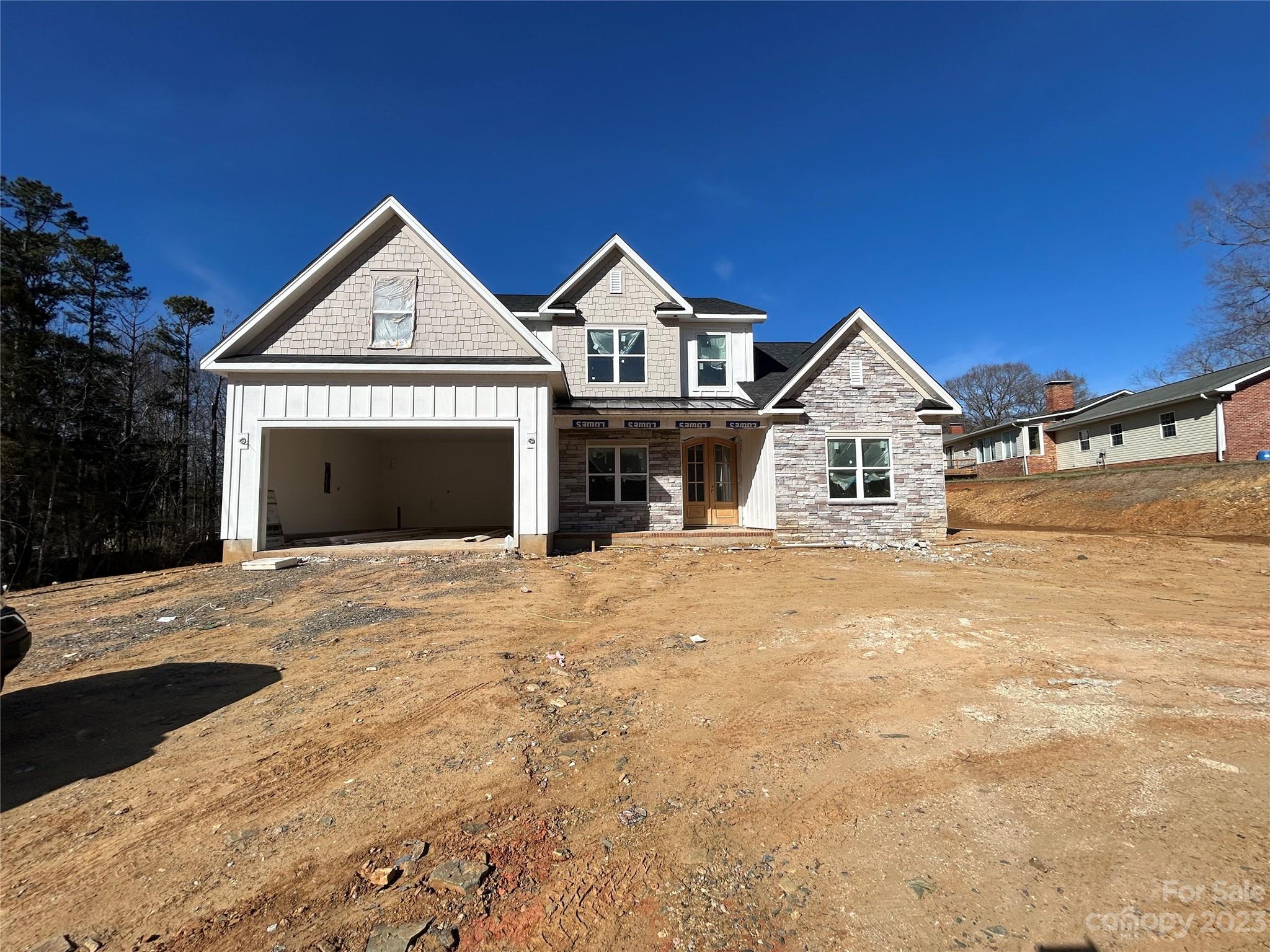 2432 Lakeview Circle Matthews, NC 28105 - Photo 2 of 20 a front view of a house with yard and parking