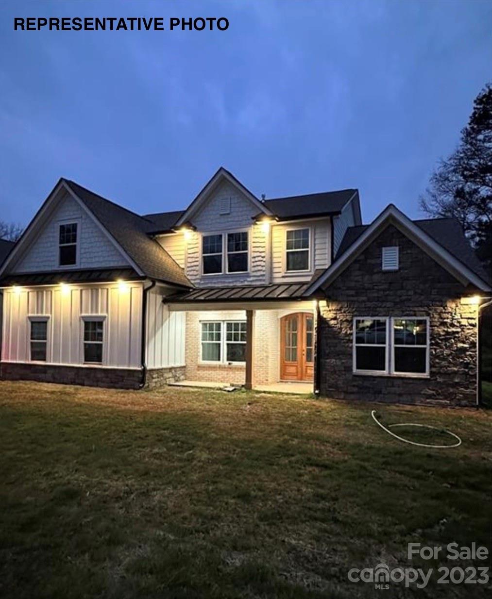 2432 Lakeview Circle Matthews, NC 28105 - Photo 3 of 20 a front view of a house with a yard