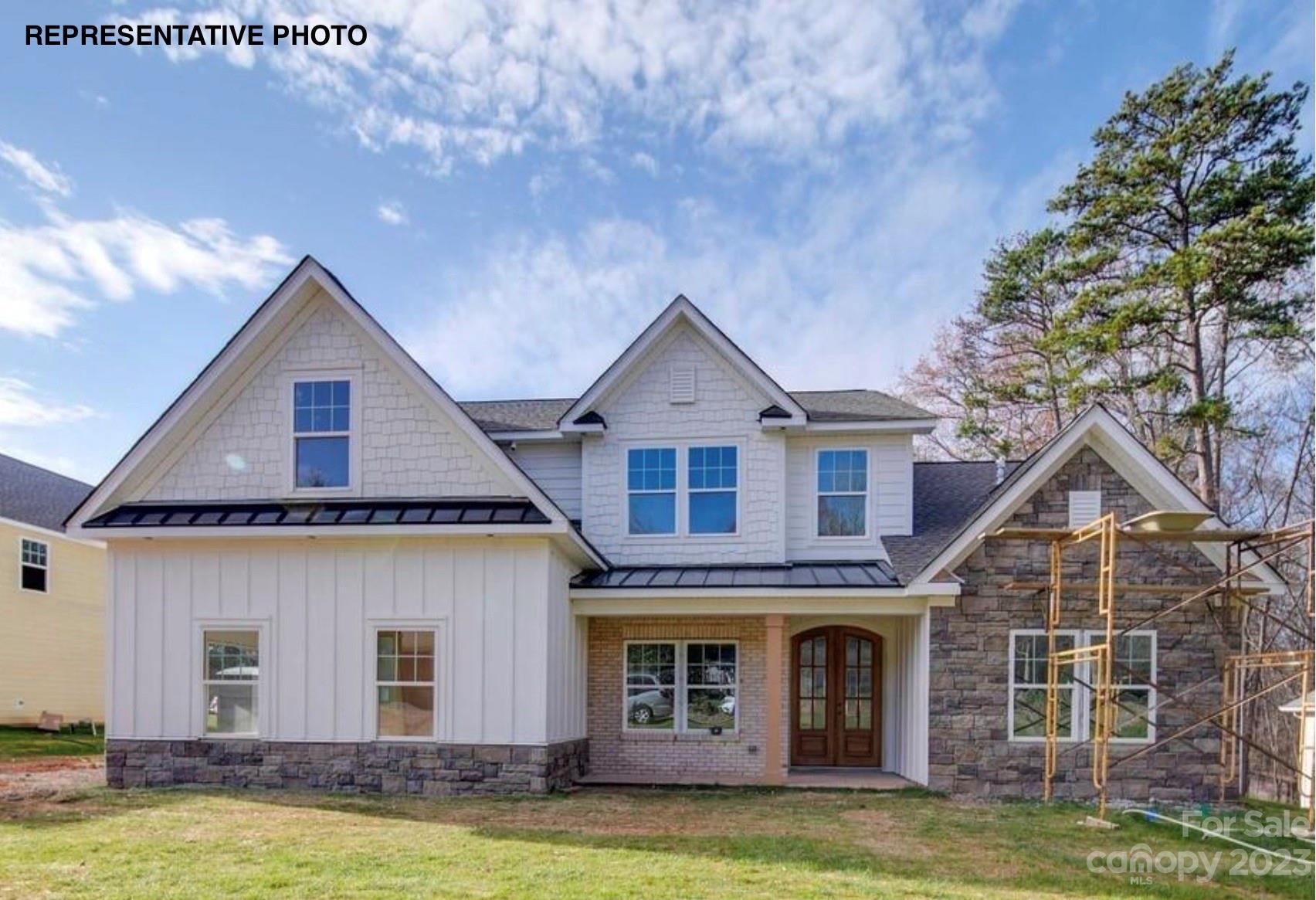 2432 Lakeview Circle Matthews, NC 28105 - Photo 4 of 20 a front view of a house with a yard