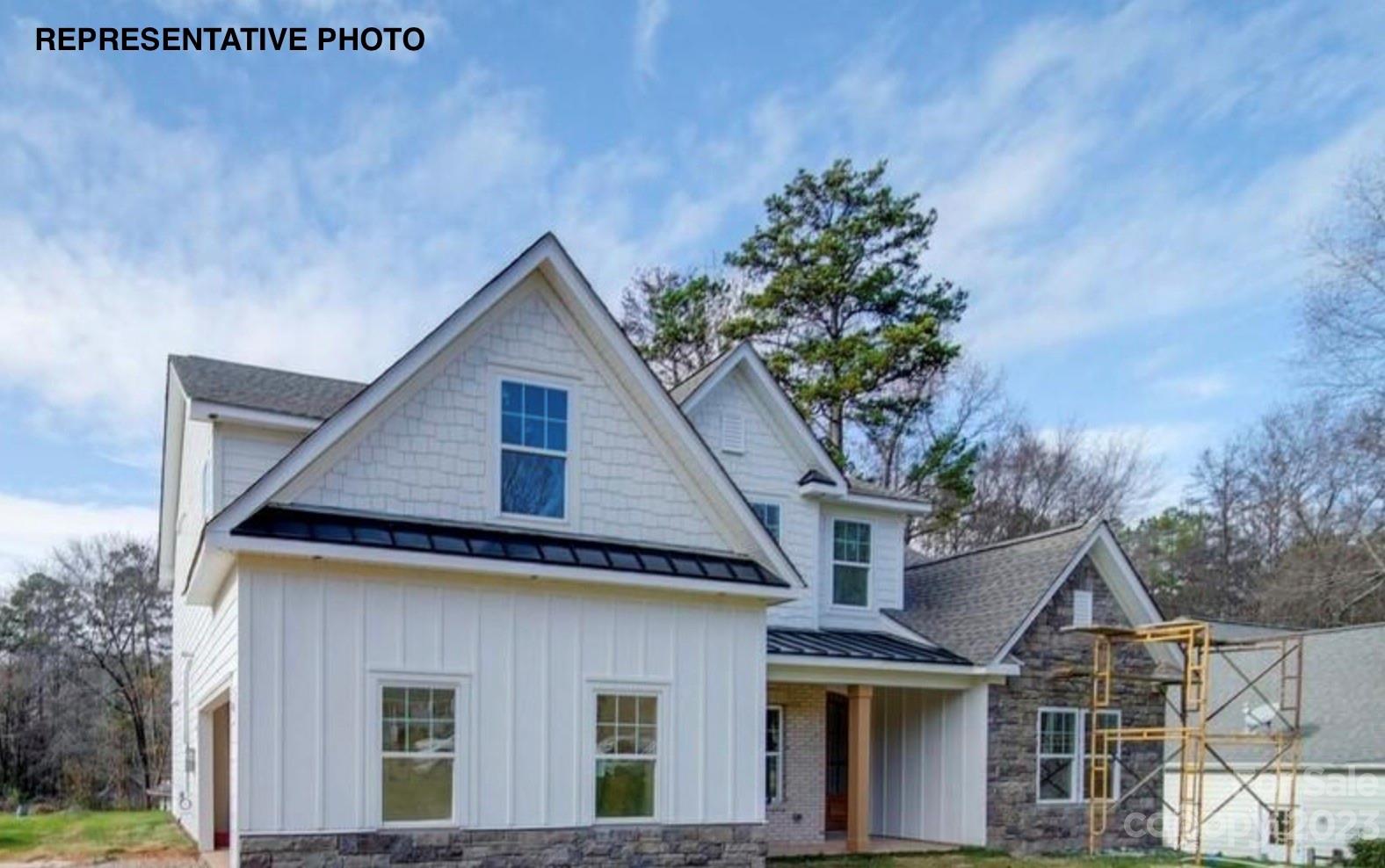 2432 Lakeview Circle Matthews, NC 28105 - Photo 5 of 20 a front view of a house with a yard