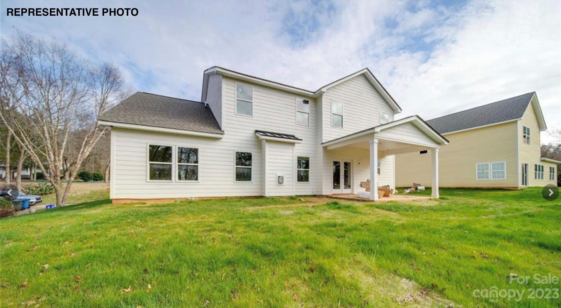 2432 Lakeview Circle Matthews, NC 28105 - Photo 7 of 20 a front view of a house with a yard