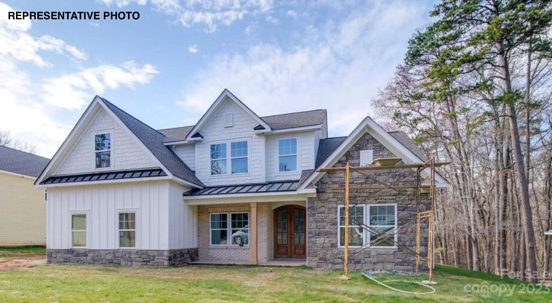 2432 Lakeview Circle Matthews, NC 28105 - Photo 8 of 20 a front view of a house with a yard