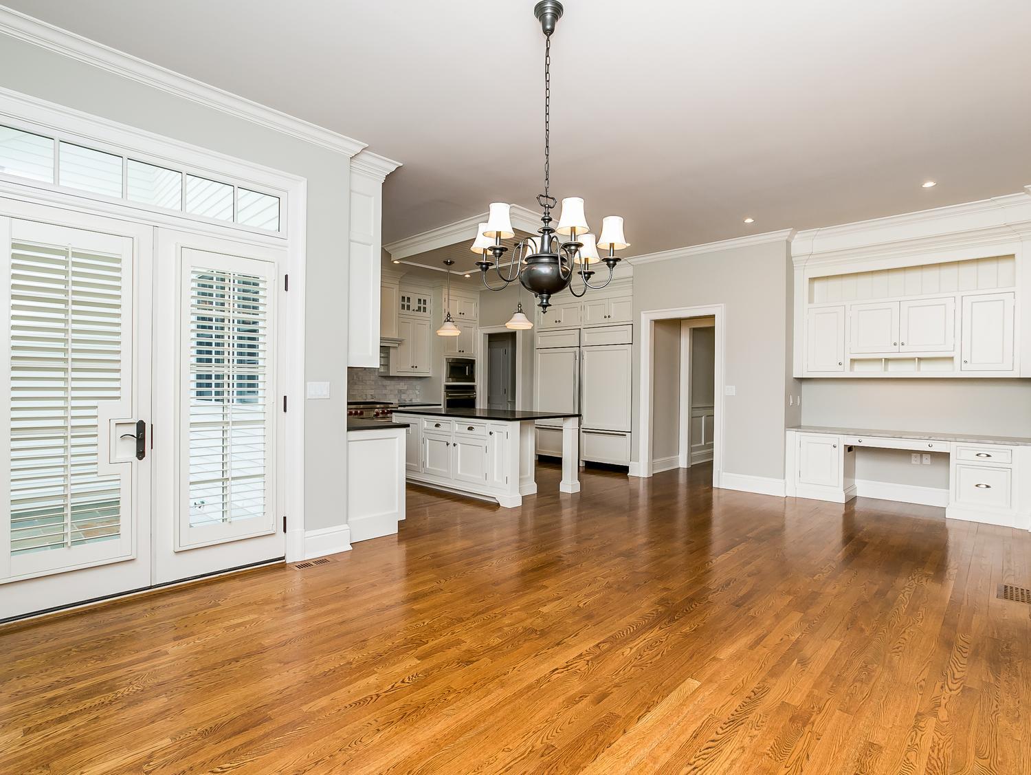 92 White Oak Shade Road New Canaan, CT 06840 - Photo 11 of 35 a view of a room with wooden floor and chandelier