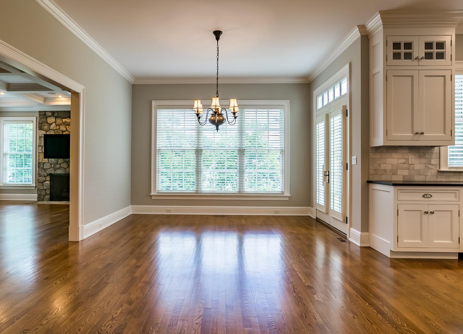 92 White Oak Shade Road New Canaan, CT 06840 - Photo 13 of 35 a view of a kitchen with a stove wooden floor and a window
