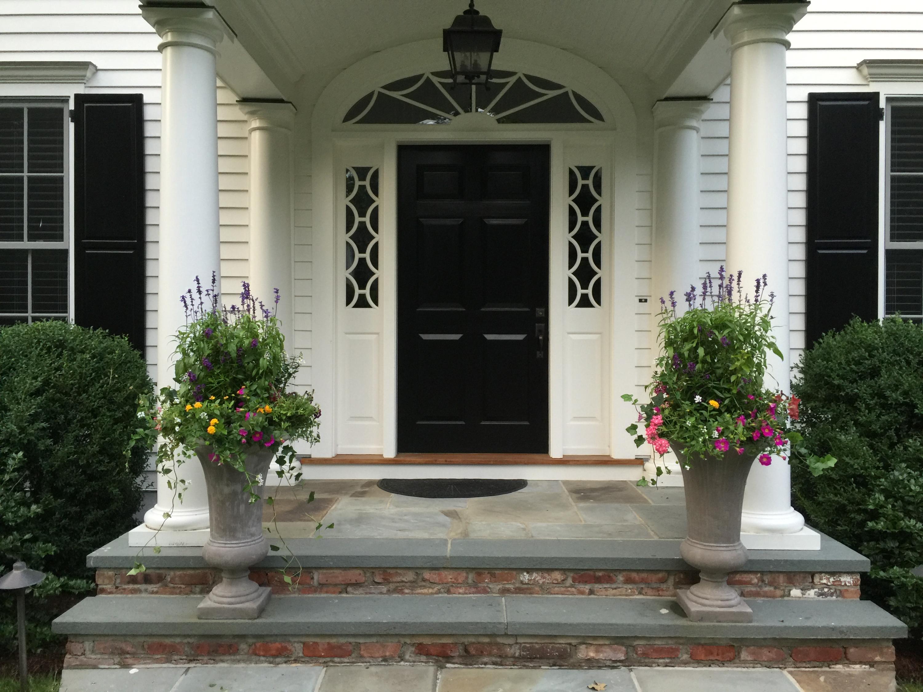 92 White Oak Shade Road New Canaan, CT 06840 - Photo 2 of 35 a view of a house with potted plants