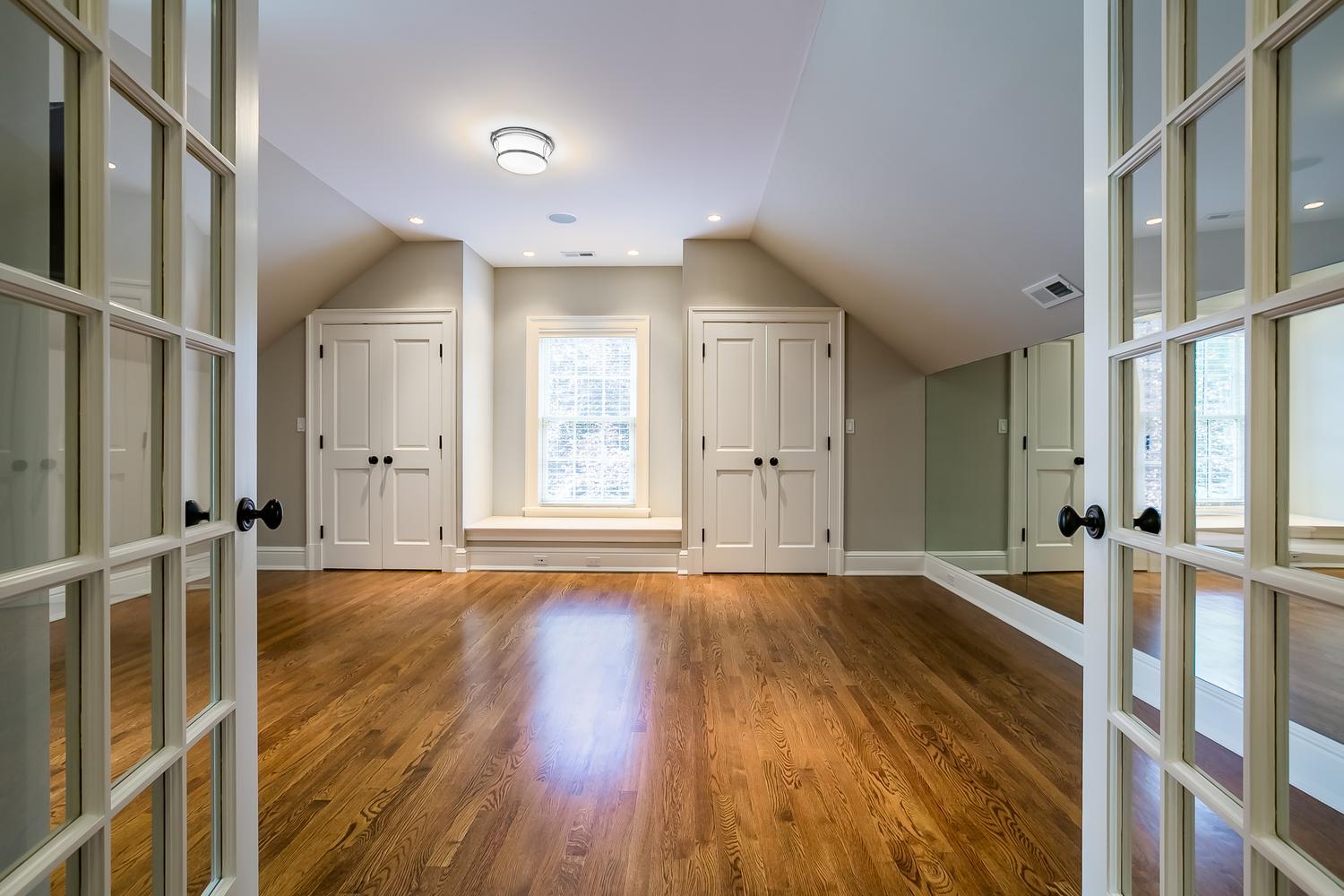 92 White Oak Shade Road New Canaan, CT 06840 - Photo 22 of 35 wooden floor in an empty room with a window