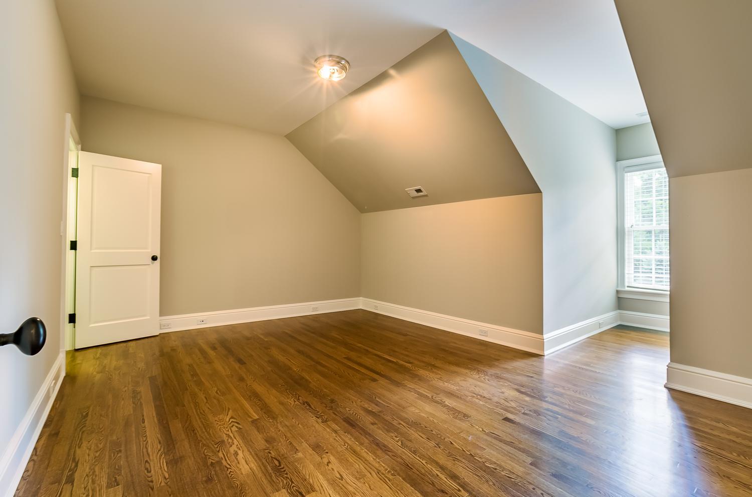 92 White Oak Shade Road New Canaan, CT 06840 - Photo 24 of 35 an empty room with wooden floor and windows