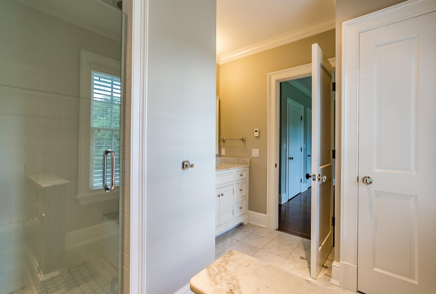 92 White Oak Shade Road New Canaan, CT 06840 - Photo 25 of 35 a bathroom with a granite countertop sink a mirror and shower