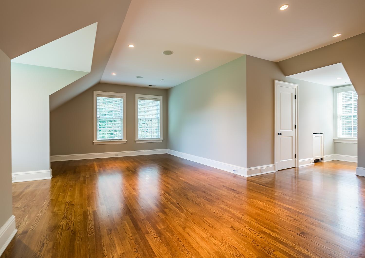 92 White Oak Shade Road New Canaan, CT 06840 - Photo 26 of 35 a view of an empty room with wooden floor and a window