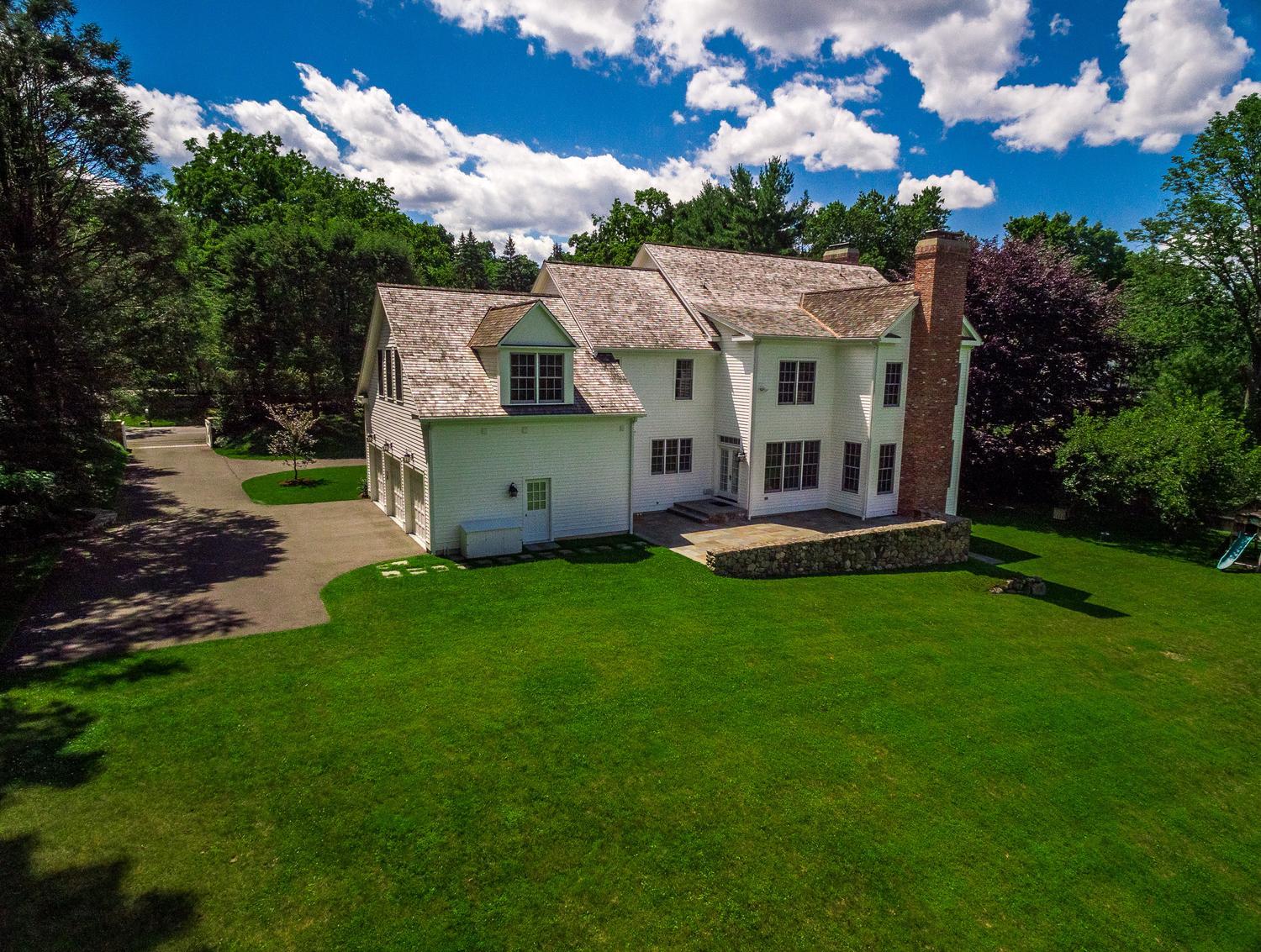 92 White Oak Shade Road New Canaan, CT 06840 - Photo 34 of 35 a view of a house with a big yard