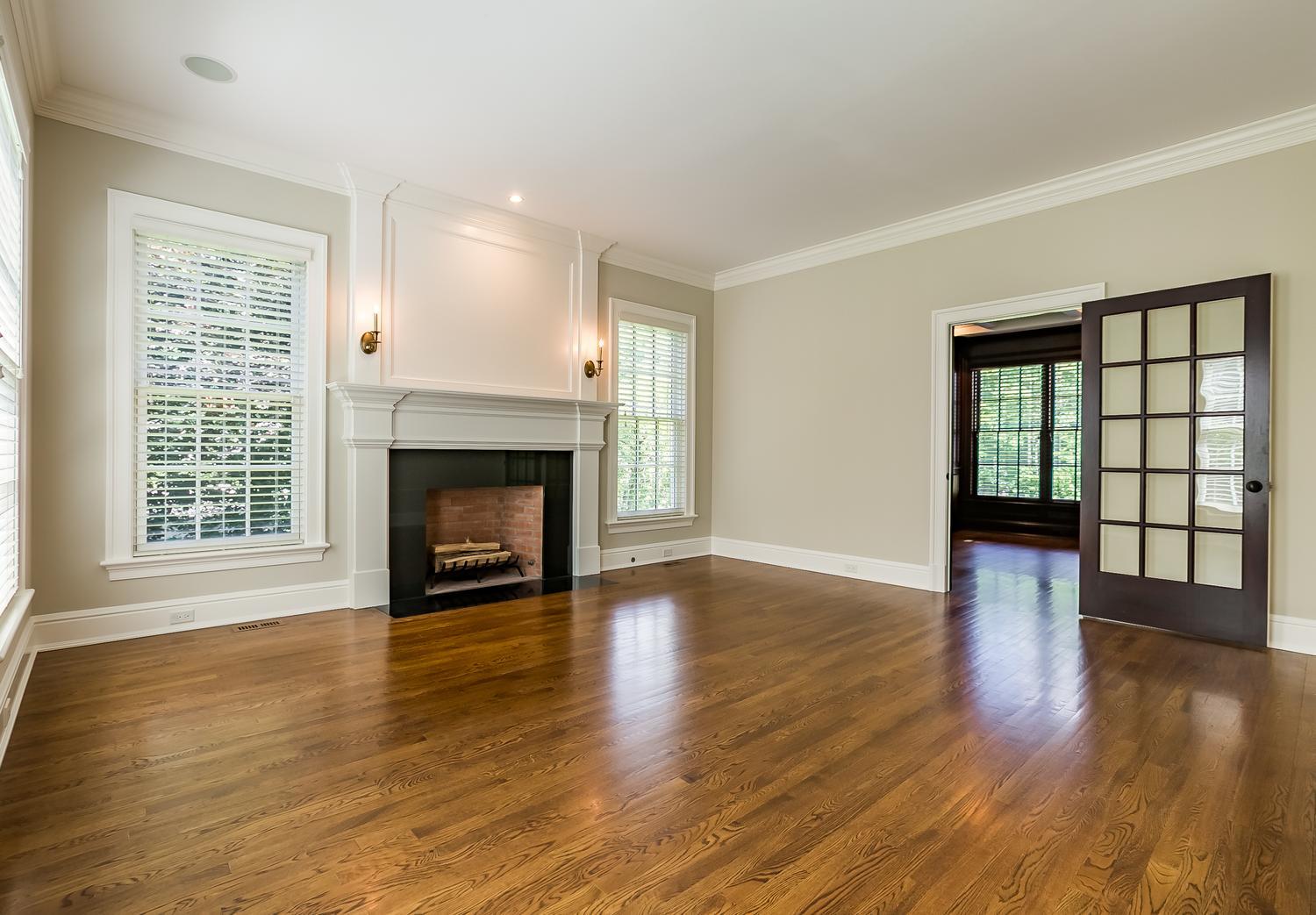 92 White Oak Shade Road New Canaan, CT 06840 - Photo 6 of 35 a view of an empty room with wooden floor and a window