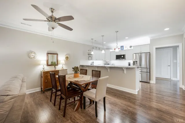 a kitchen with a sink window and cabinets