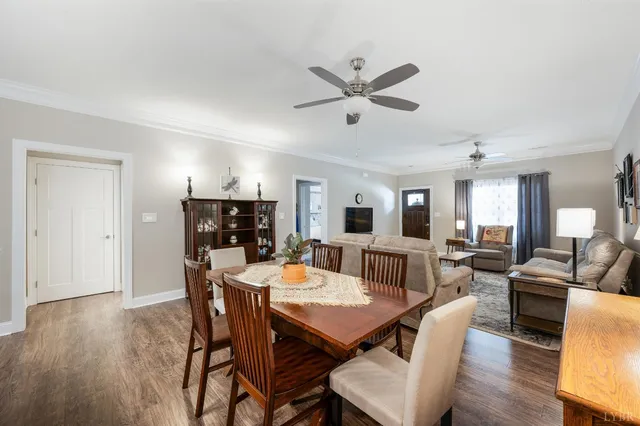 a kitchen with granite countertop a refrigerator stove and sink