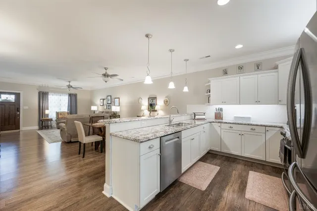 a kitchen with a sink and a refrigerator