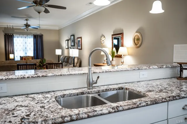 a large kitchen with kitchen island sink and stove