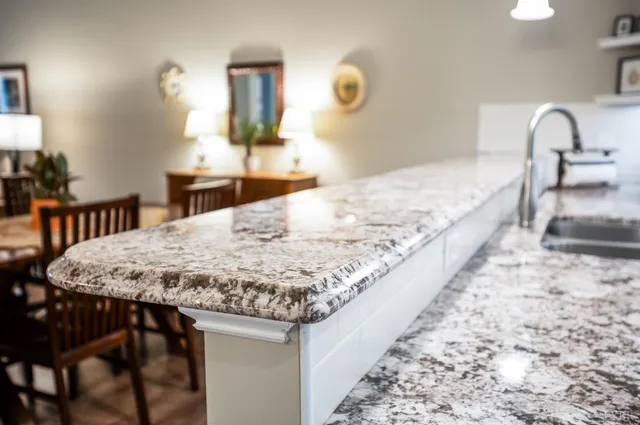 a view of a hallway with wooden floor and furniture