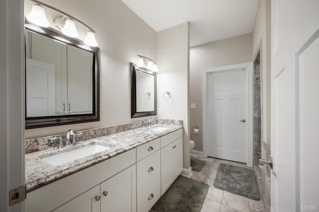 a view of walk in closet with clothes