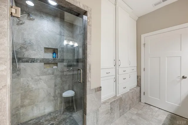 a living room with furniture a lamp and a window