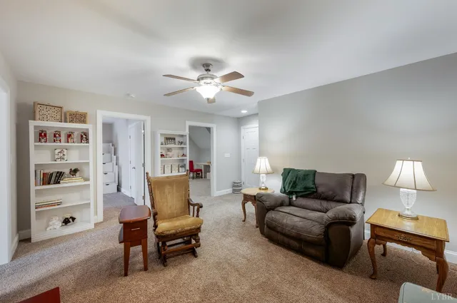 a bedroom with a bed and ceiling fan