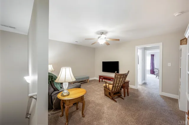 a bedroom with a bed and a chair