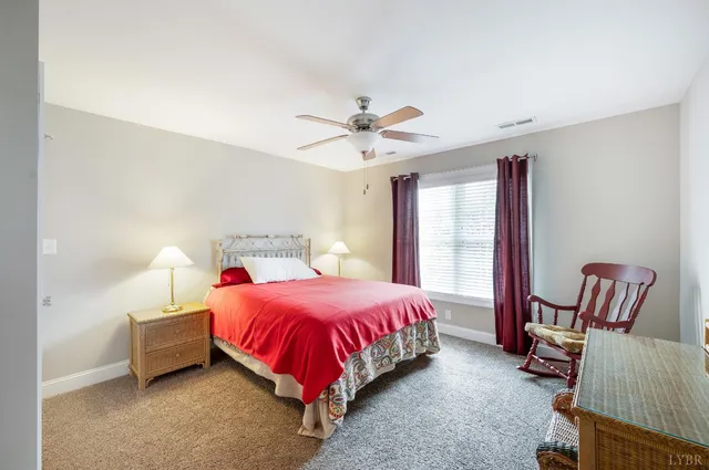 a bathroom with a toilet a sink and a mirror