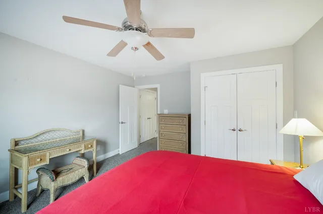 a view of a hallway with wooden floor and entryway