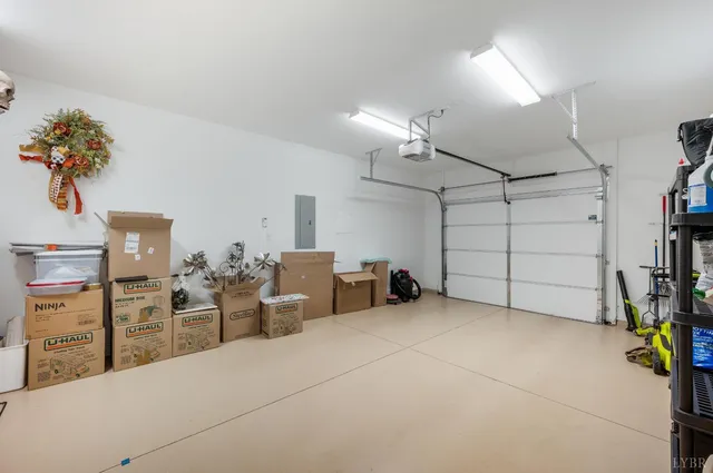 an aerial view of a house with garden space and ocean view