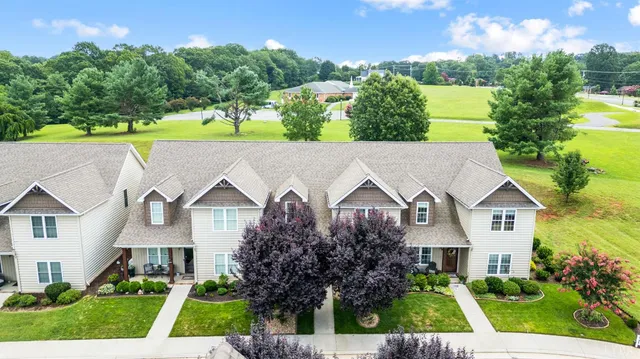 a view of a patio with a table and chairs and wooden floor