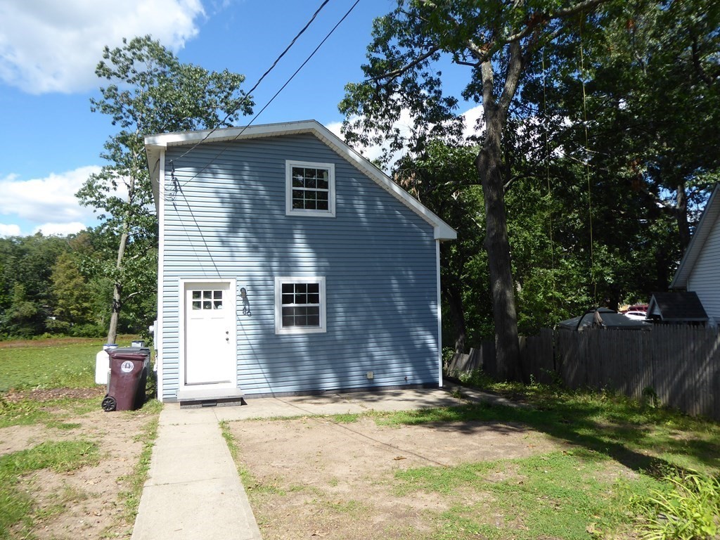 86 Pequot Point Road Westfield, MA 01085 - Photo 20 of 21 a backyard of a house with table and chairs