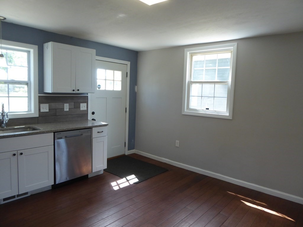86 Pequot Point Road Westfield, MA 01085 - Photo 9 of 21 a kitchen with granite countertop a stove a sink and a window