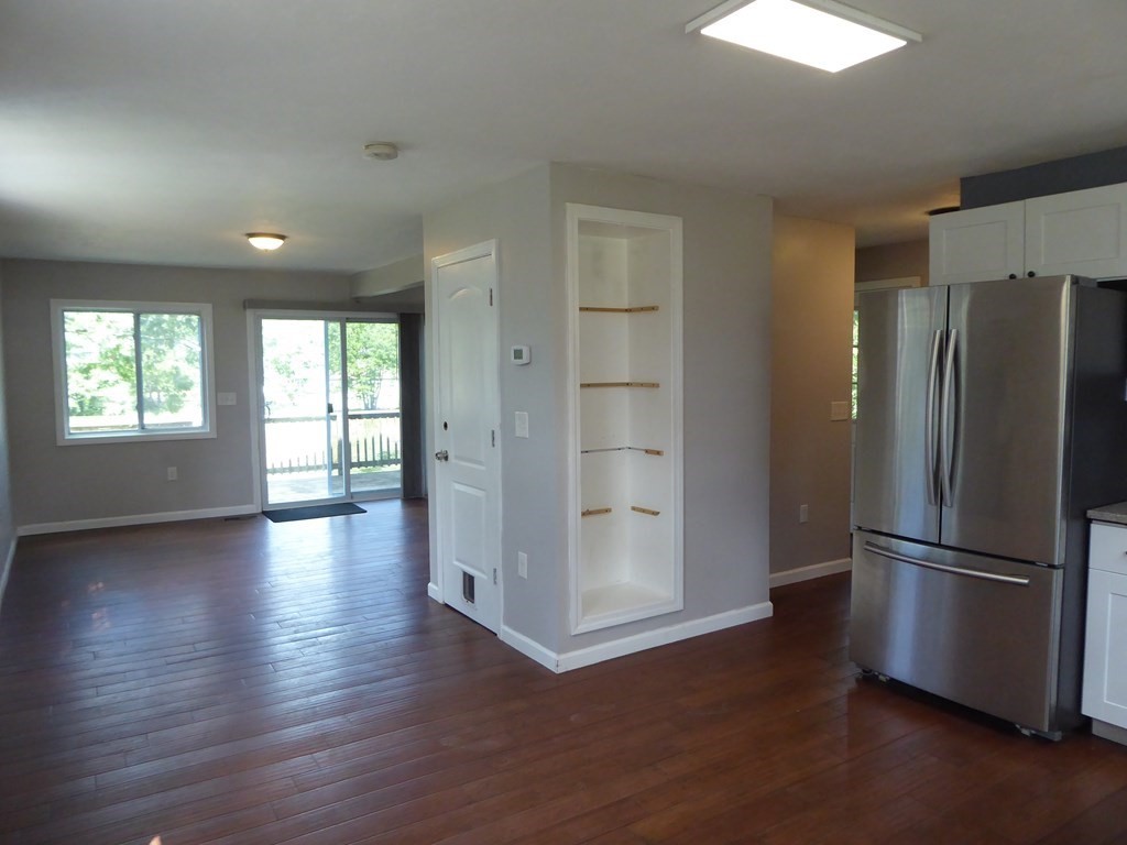 86 Pequot Point Road Westfield, MA 01085 - Photo 10 of 21 a view of an empty room with wooden floor and a window