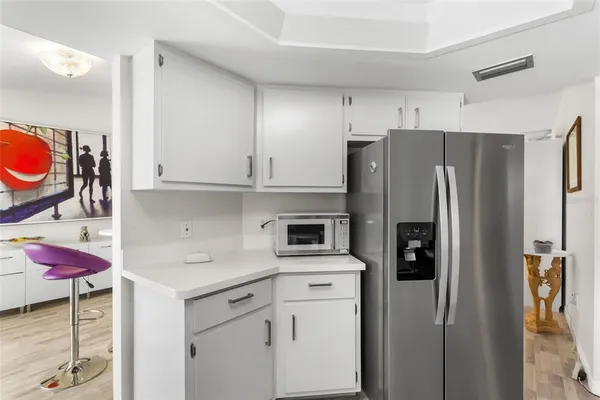 a kitchen with stainless steel appliances cabinets and a refrigerator