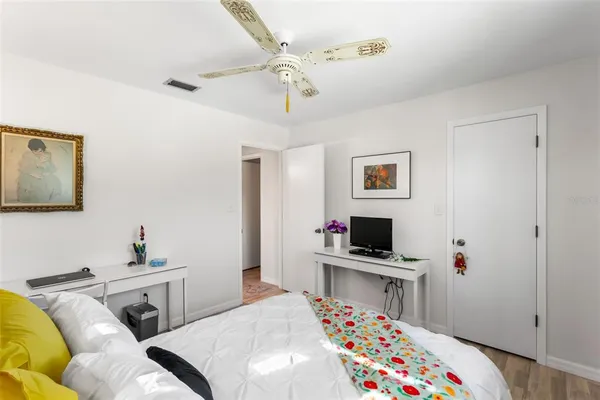 a bedroom with a bed and a table in it