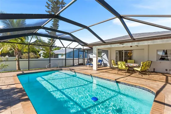 a view of a backyard with swimming pool