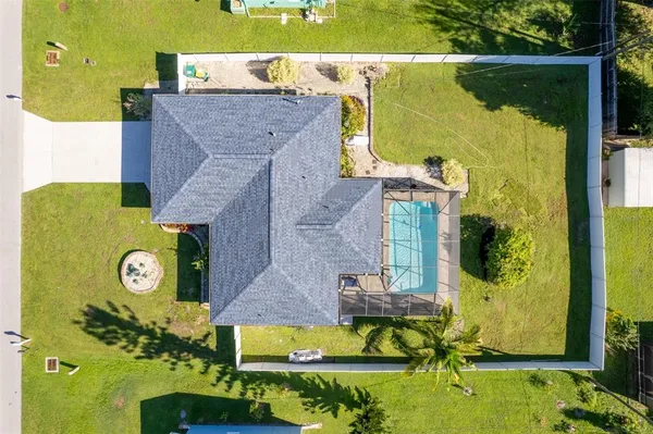 an aerial view of a house with a swimming pool