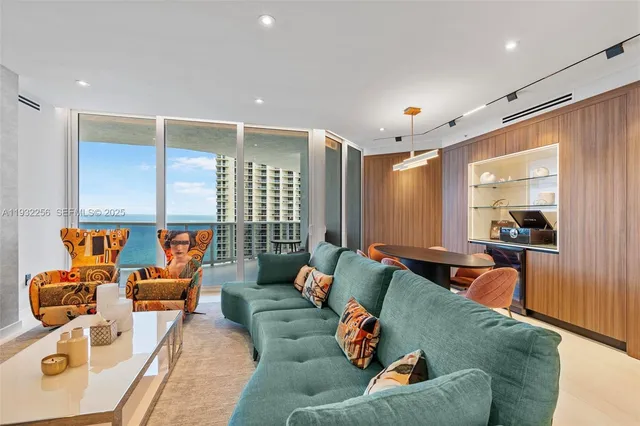 a living room with furniture and a large window