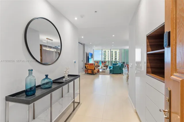 a very nice looking room with a large mirror and sink