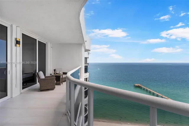 a view of a balcony and chairs