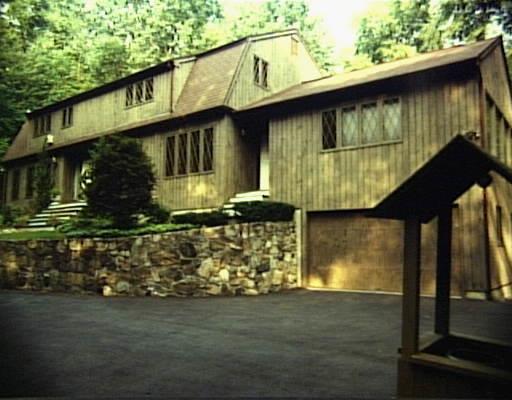 250 Wilton East Road Ridgefield, CT 06877 - Photo 1 of 1 a front view of a house with a garden