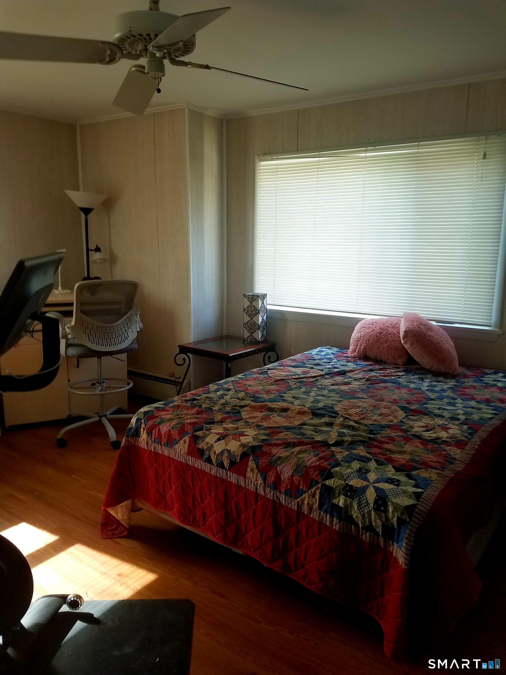 72 Maple Tree Avenue, Unit 2 Stamford, CT 06906 - Photo 15 of 25 a bedroom with a bed and wooden floor