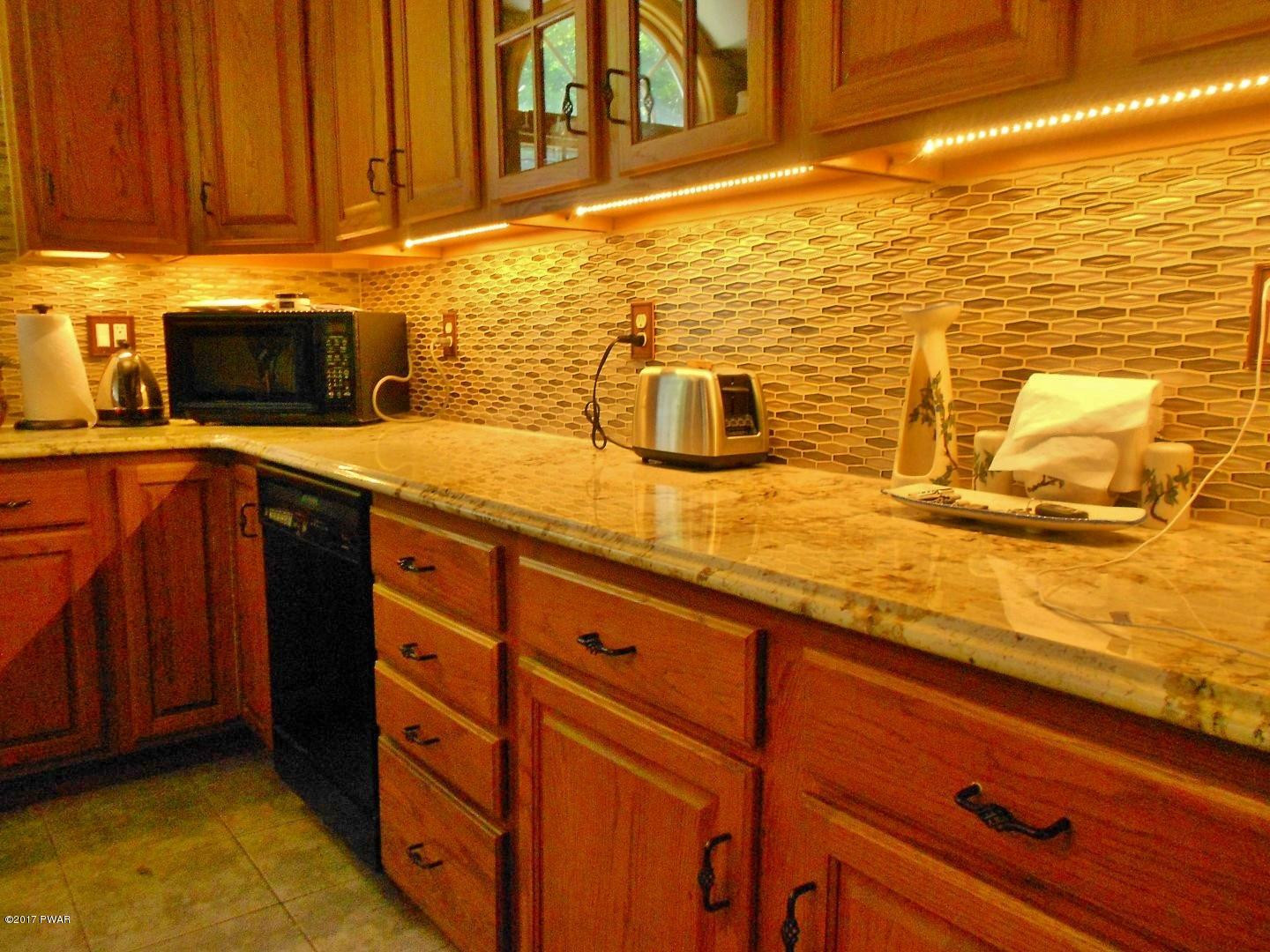 271 Sawmill Road Greentown, PA 18426 - Photo 8 of 36 a kitchen with stainless steel appliances a sink and cabinets