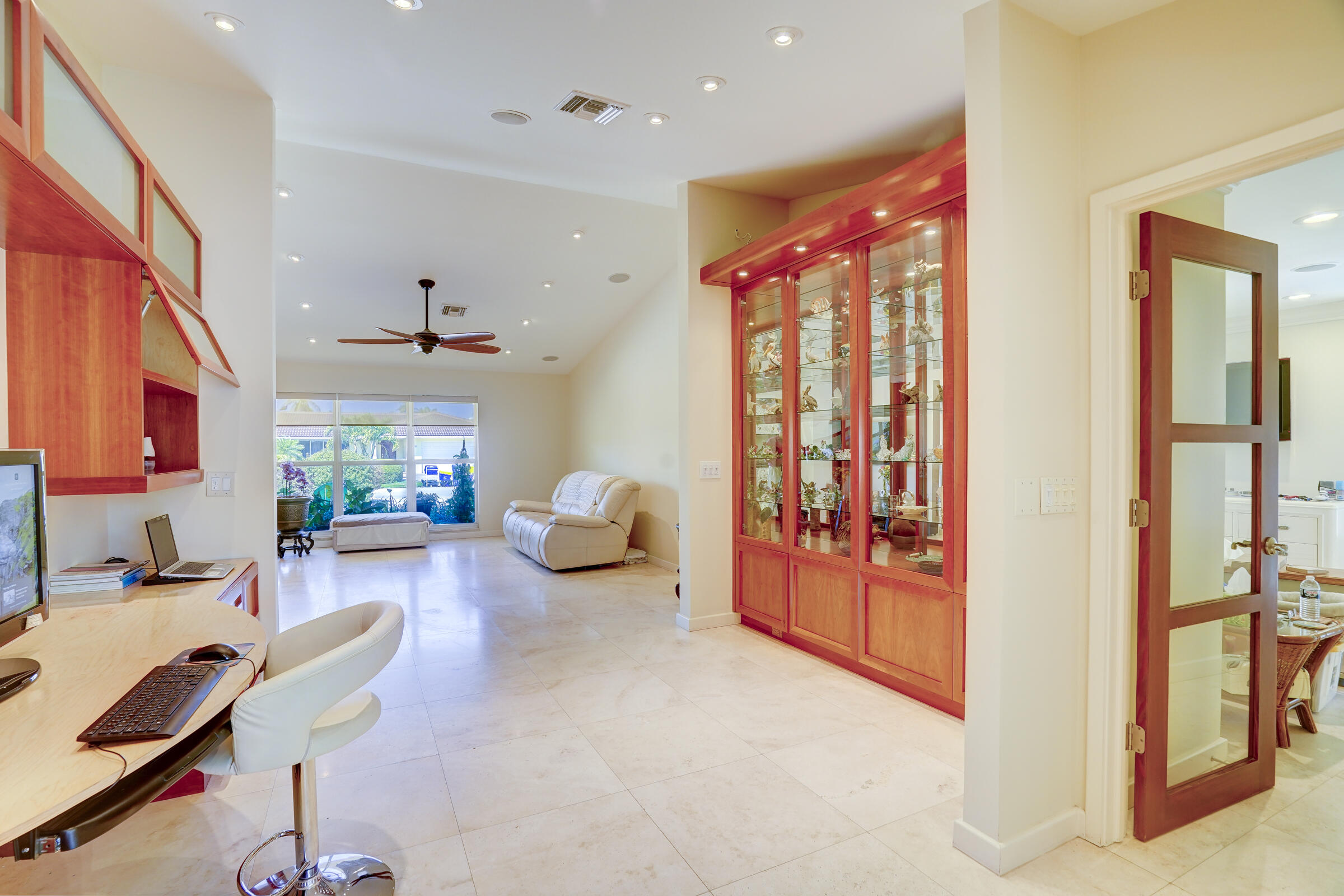 1191 Emerald Drive Singer Island, FL 33404 - Photo 13 of 60 a living room with furniture and a window