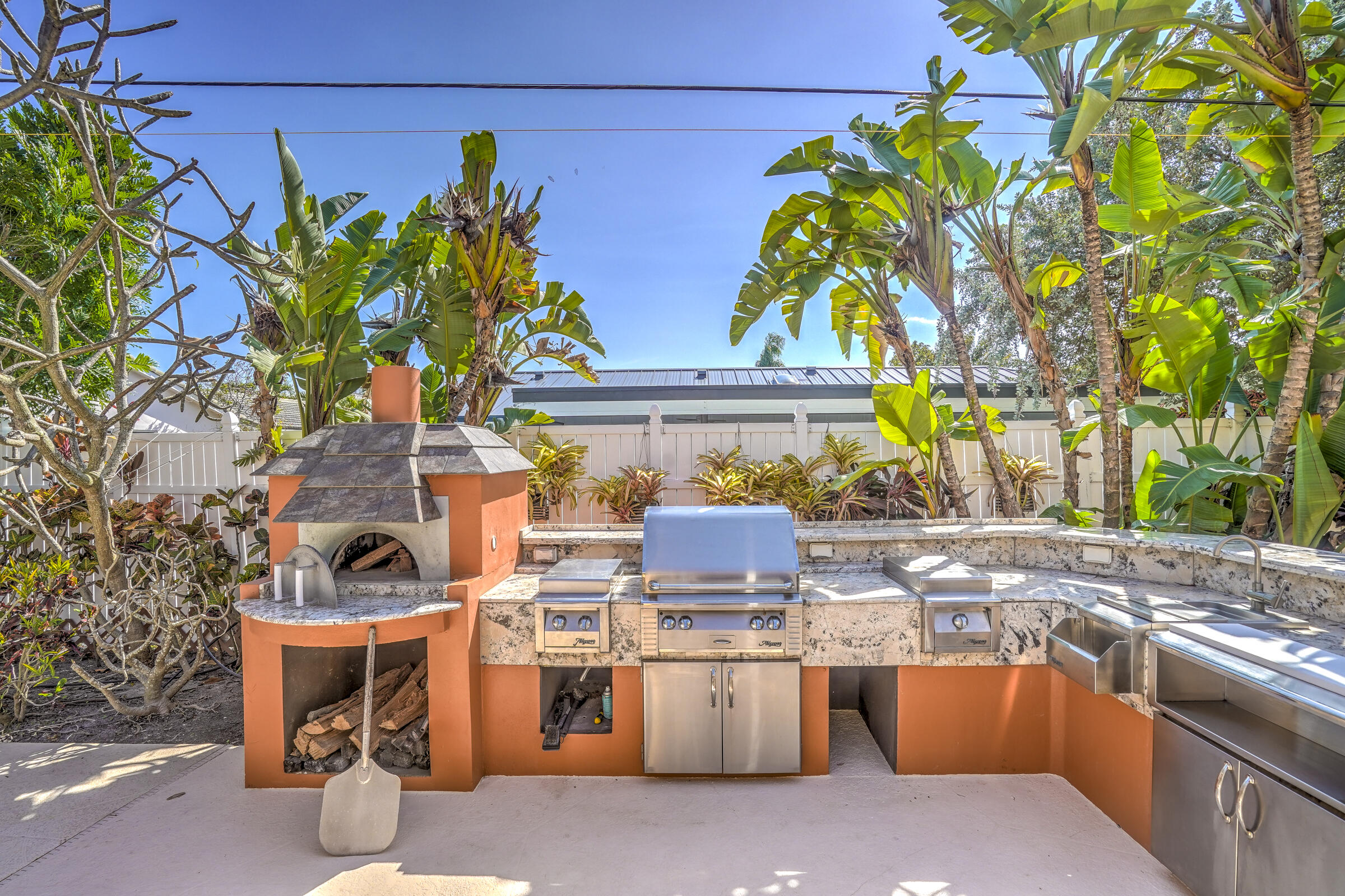 1191 Emerald Drive Singer Island, FL 33404 - Photo 2 of 60 a view of a patio with swimming pool