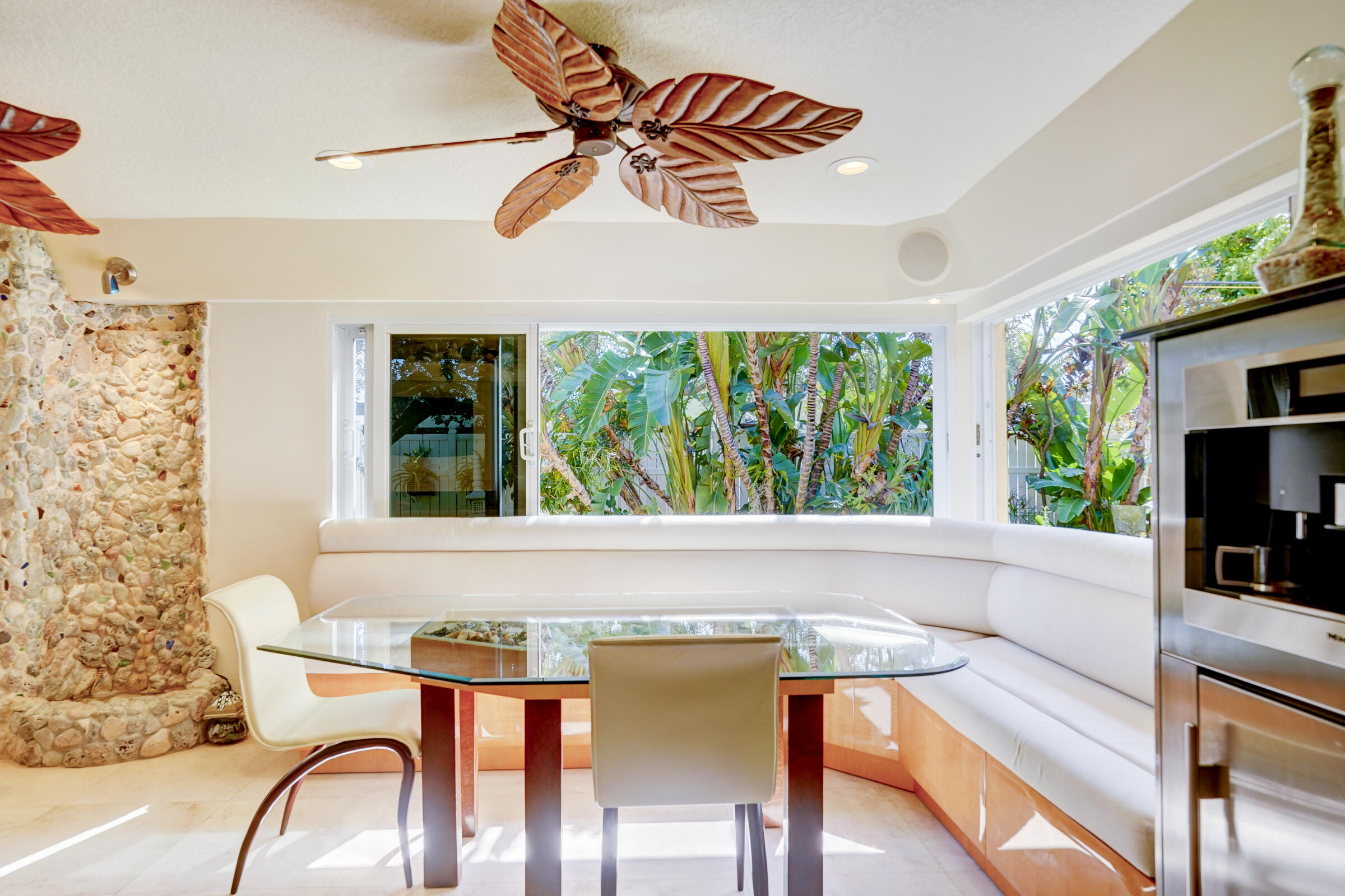 1191 Emerald Drive Singer Island, FL 33404 - Photo 22 of 60 a view of a dining room with furniture window and outside view