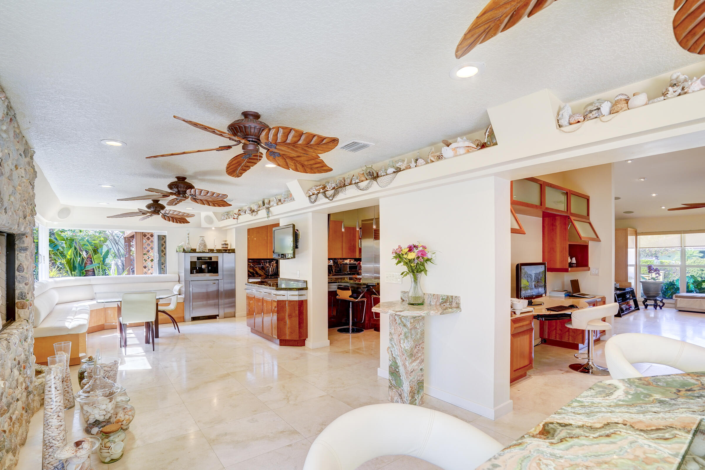 1191 Emerald Drive Singer Island, FL 33404 - Photo 31 of 60 a living room with furniture and kitchen view