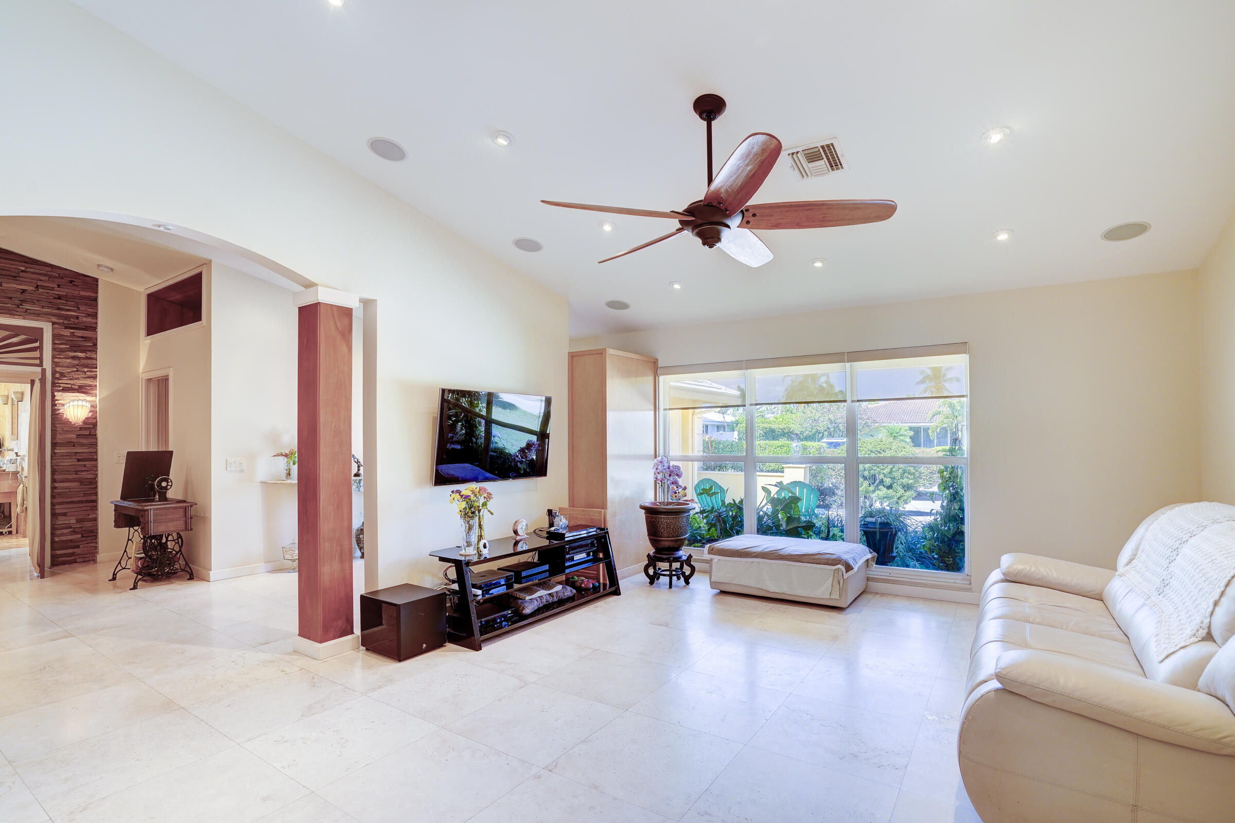 1191 Emerald Drive Singer Island, FL 33404 - Photo 5 of 60 a living room with furniture and a flat screen tv